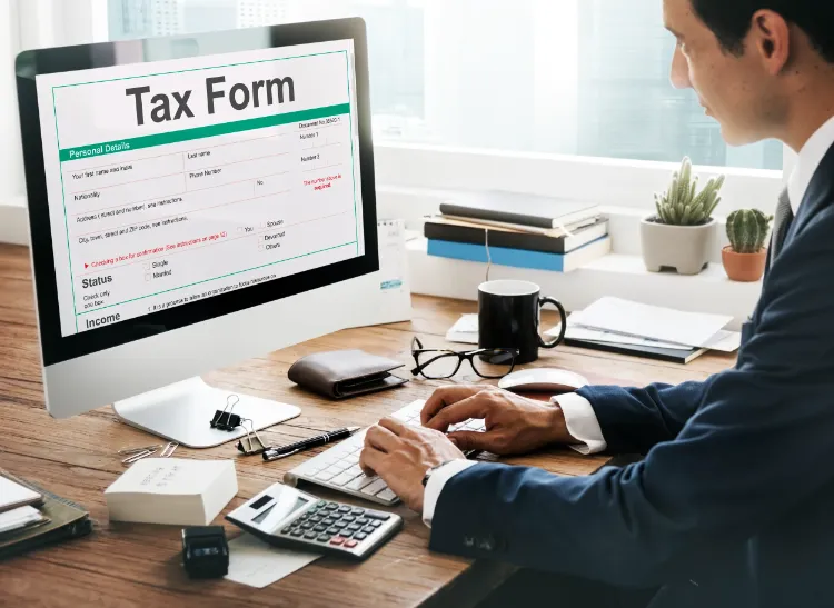 Business professional reviewing a tax form on a computer as part of the process to start a company in Croatia