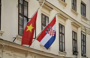 Vietnam and Croatian flags hanging outside an official building in Croatia