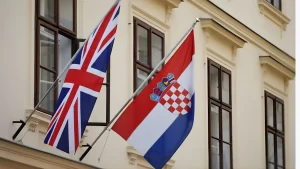 British and Croatian flags hanging outside an official building in Croatia