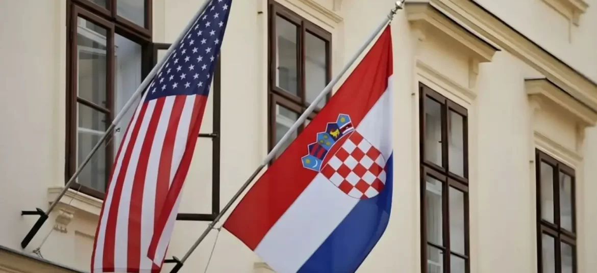 American and Croatian flags hanging outside an official building in Croatia