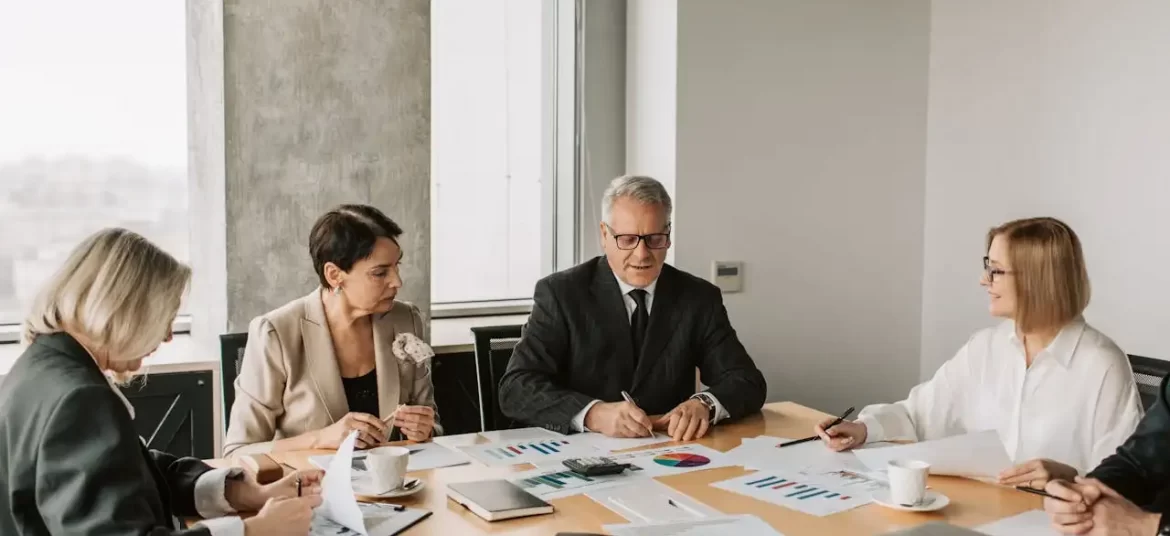 Senior business experts discussing market planning and legal requirements for Starting a Business in Croatia for foreigner during a strategy meeting.